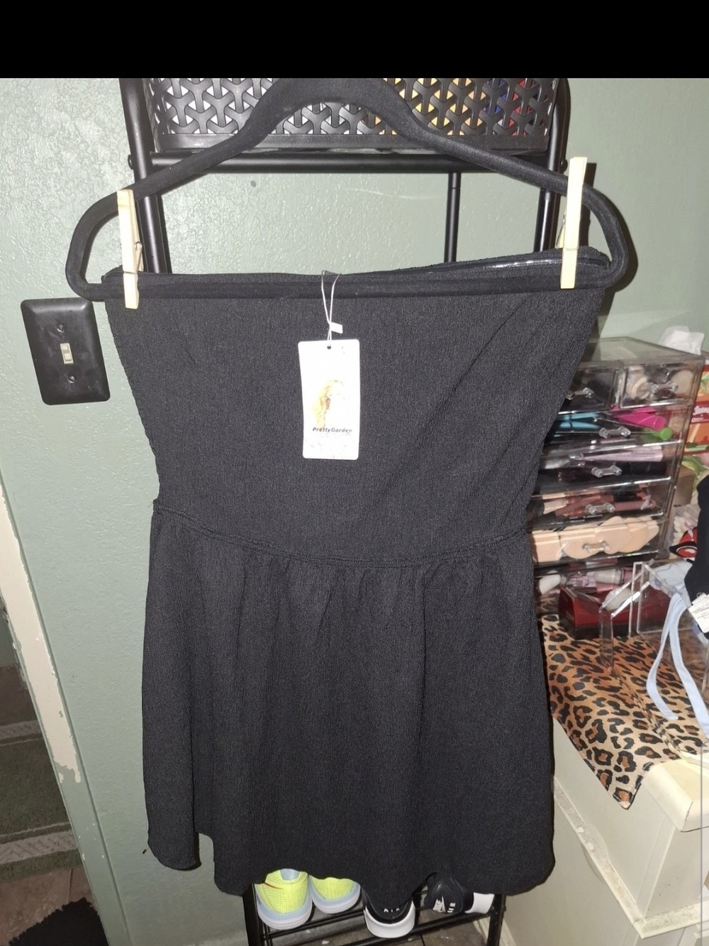 PrettyGarden black strapless mini dress featuring a textured fabric and a flared